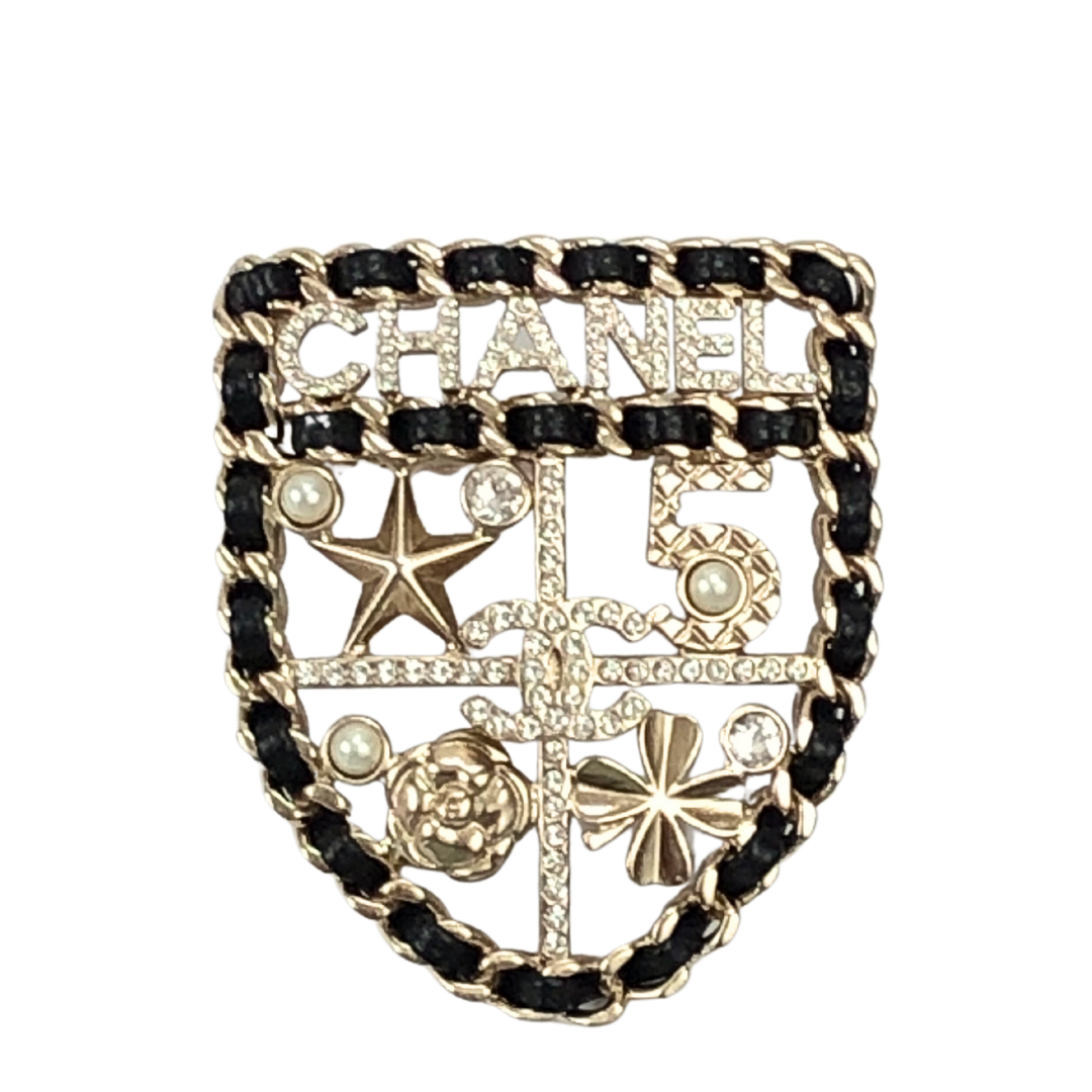 chanel shield brooch